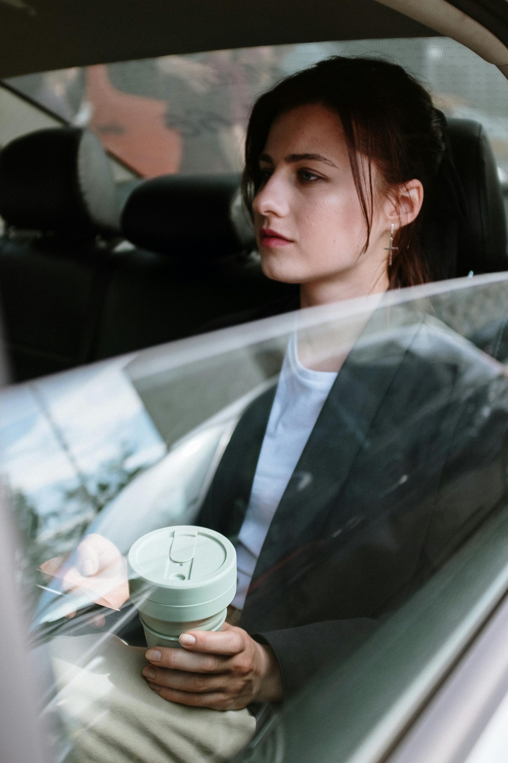 Woman sitting comfortably in luxury car service
